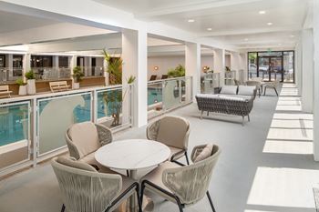 the tables and chairs next to indoor pool at Vision On Lombard Baltimore Maryland